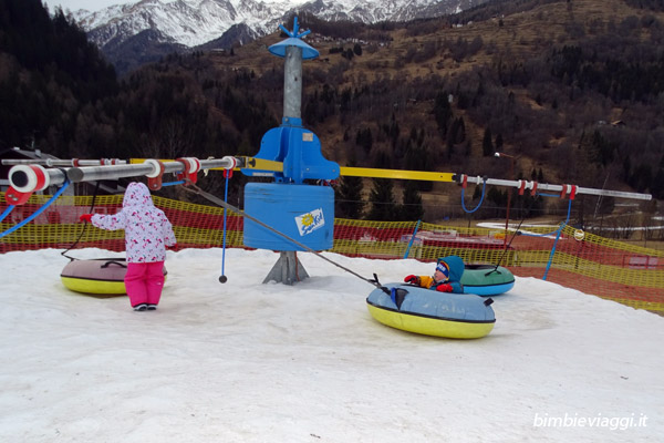Val di Sole con bambini - giostra - Vacanza sulla neve in Trentino con bimbi